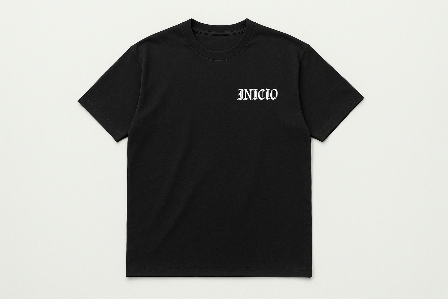 Black t-shirt with white INICIO logo - flat lay