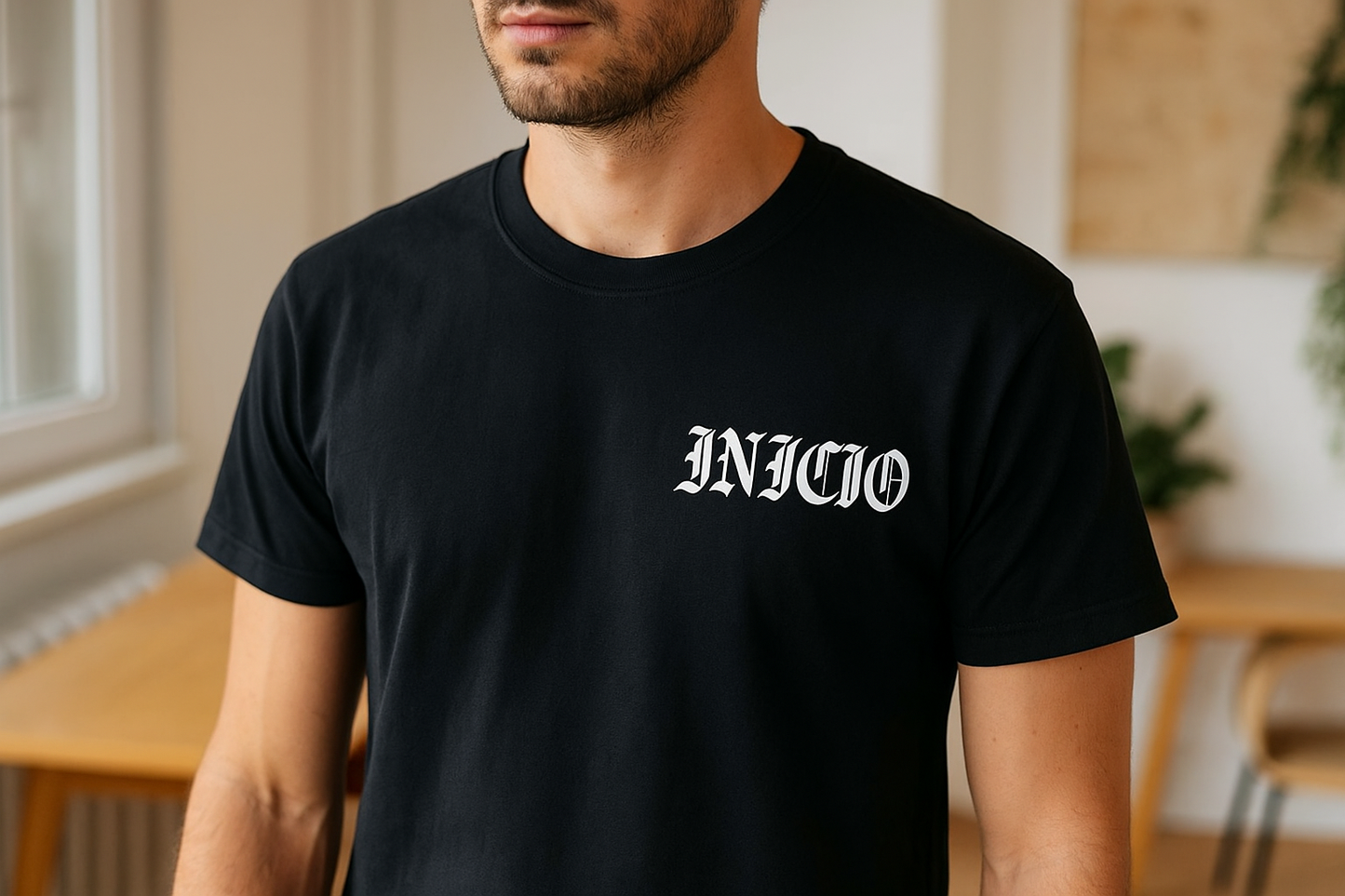Black t-shirt with white INICIO logo - model view