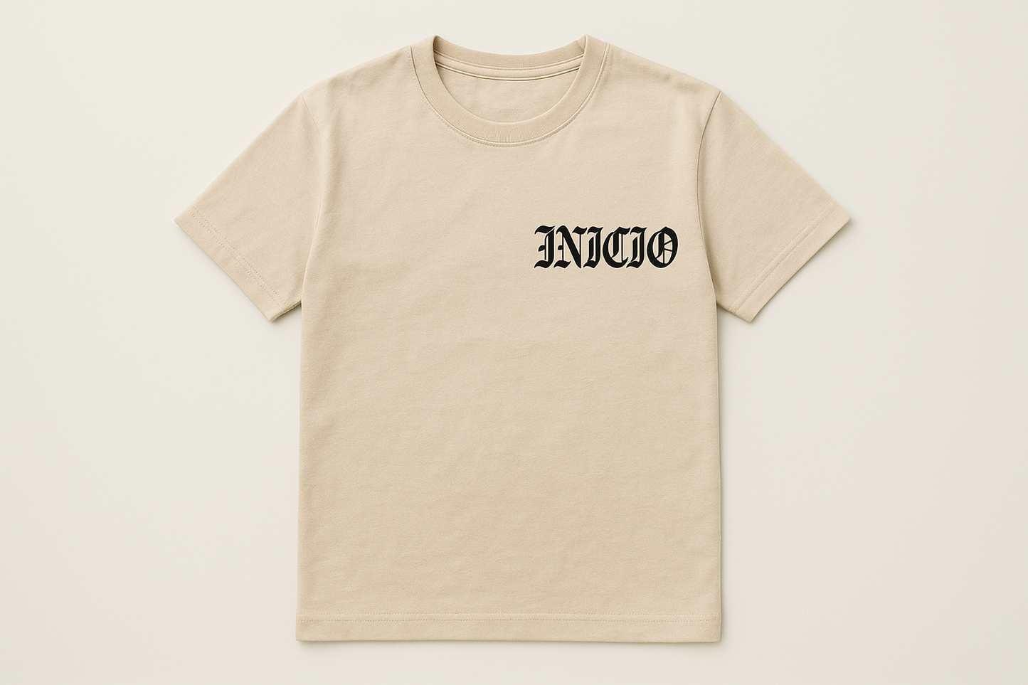 Light tan t-shirt with black INICIO logo - flat lay