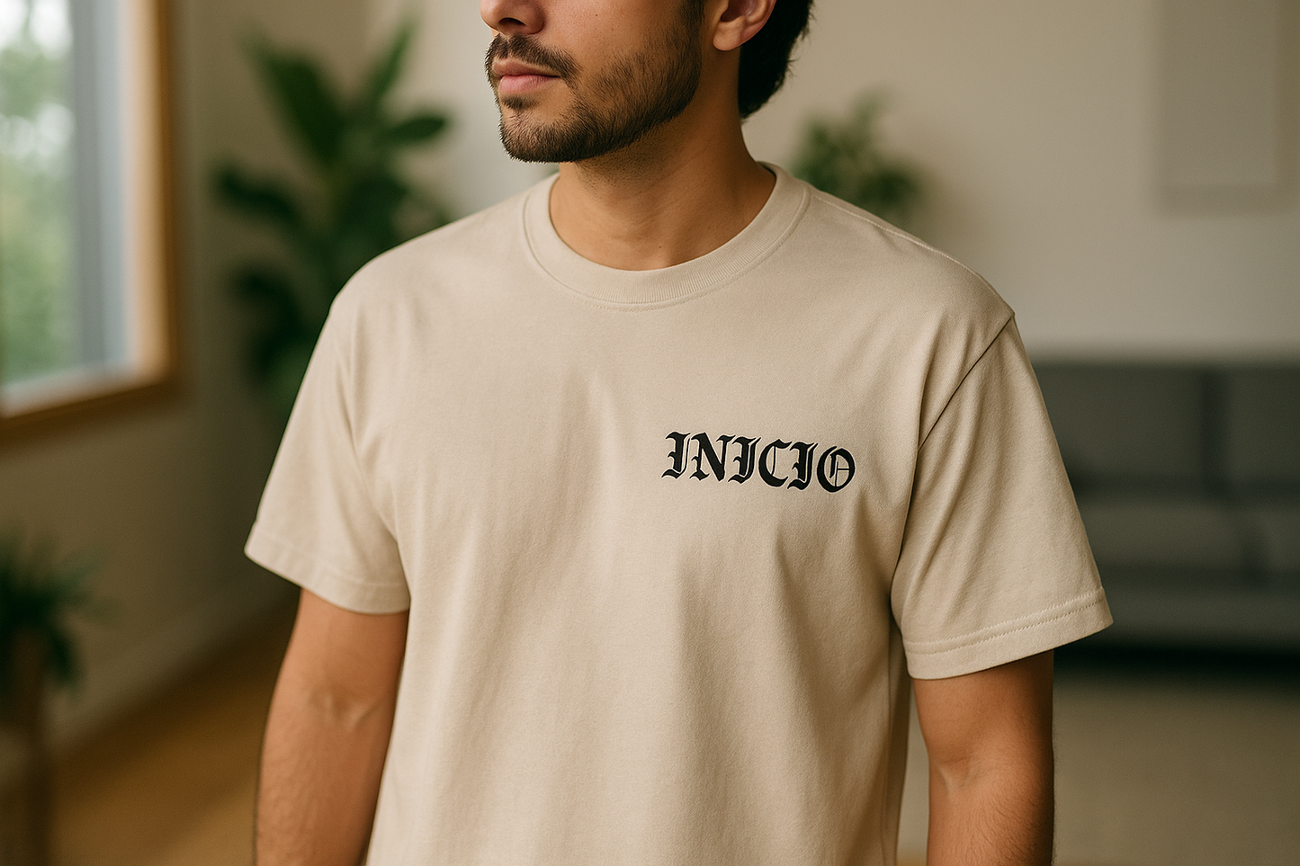 Light tan t-shirt with black INICIO logo - model view