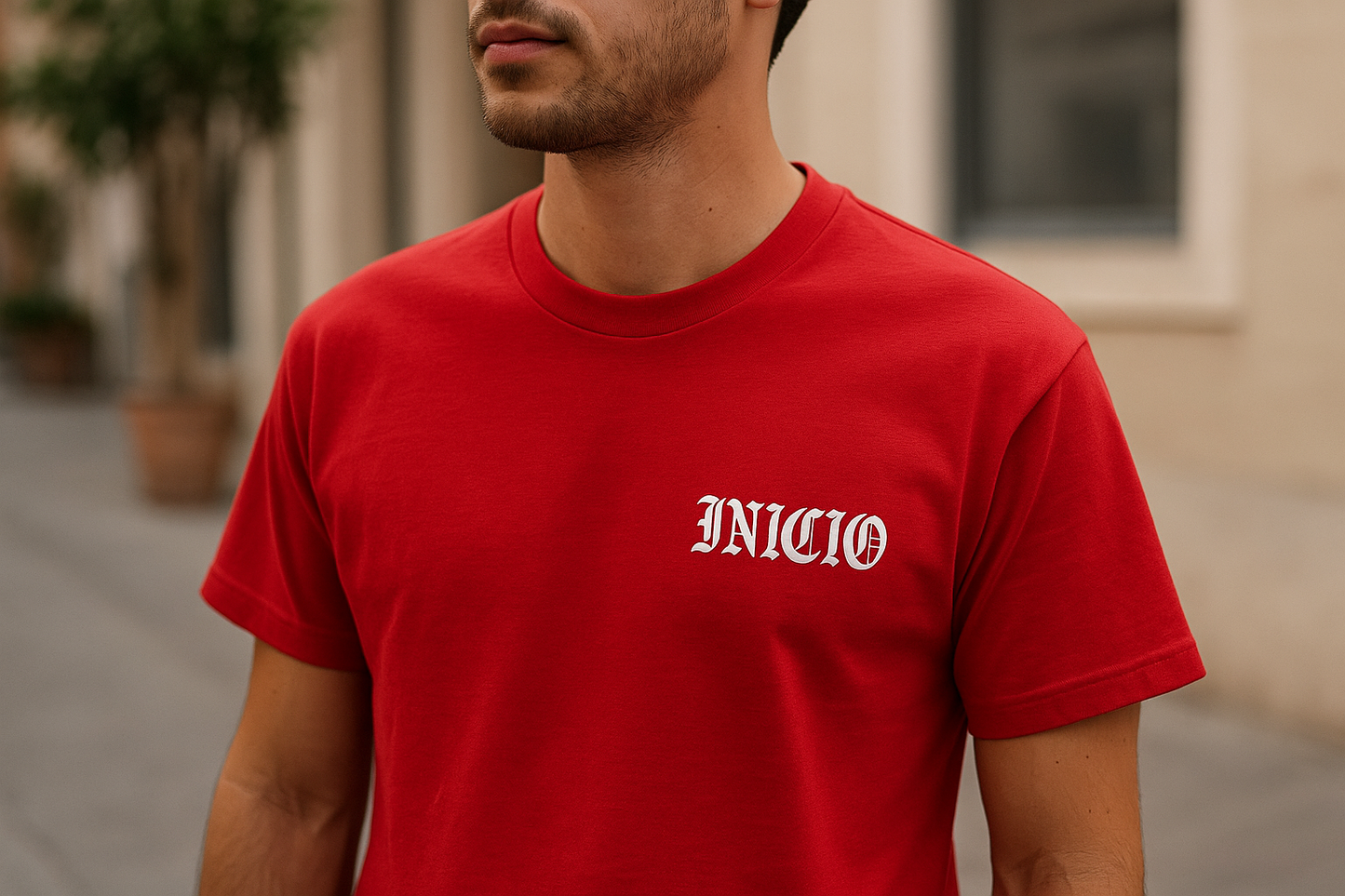 Red t-shirt with white INICIO logo - model view